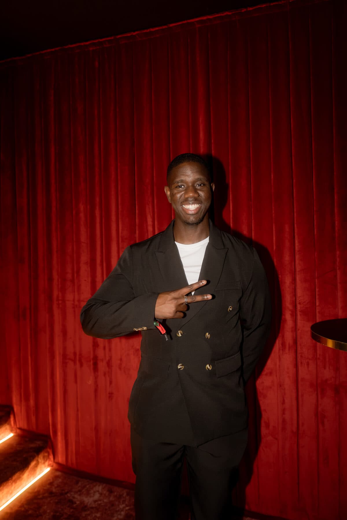 Guest in a tailored blazer at a Culturin night in Cannes